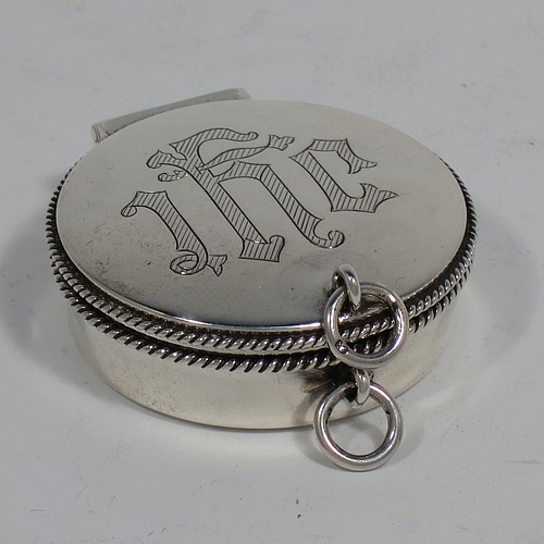 A handsome Sterling Silver Pyx box, having a plain round body with applied rope-twist borders, a hinged lid with a hand-engraved Christogram, a gold-gilt interior, and with a pair of ring handles. Made by B. & W. Ltd., of London in 1960. The dimensions of this fine hand-made silver Pyx box are diameter 5 cms (2 inches), depth 2 cms (0.5 inches), and it weighs approx. 52g (1.7 troy ounces).    