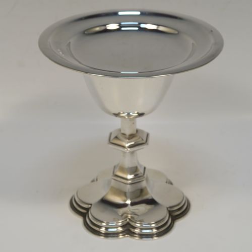 A very handsome Antique Sterling Silver altar chalice and paten, having a plain round tapering cup, a middle hexagonal baluster, sitting on a spreading hexafoil foot, and a plain round paten. The chalice was made by Goldsmiths and Silversmiths of London in 1914, and the paten was made by the Dixon Brothers of Sheffield in 1911. The dimensions of this fine hand-made antique silver chalice and paten are height of chalice 12.5 cms (5 inches), diameter of paten 12.5 cms (5 inches), and with a total weight of approx. 241g (7.8 troy ounces).   