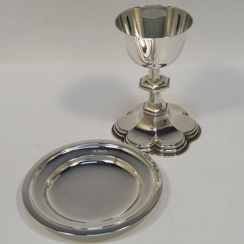 A very handsome Antique Sterling Silver altar chalice and paten, having a plain round tapering cup, a middle hexagonal baluster, sitting on a spreading hexafoil foot, and a plain round paten. The chalice was made by Goldsmiths and Silversmiths of London in 1914, and the paten was made by the Dixon Brothers of Sheffield in 1911. The dimensions of this fine hand-made antique silver chalice and paten are height of chalice 12.5 cms (5 inches), diameter of paten 12.5 cms (5 inches), and with a total weight of approx. 241g (7.8 troy ounces).   