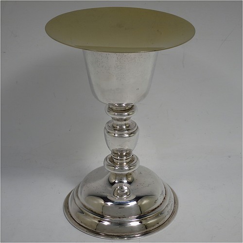 A very handsome Sterling Silver altar chalice and paten, having a plain round tapering cup with a gold-gilt interior, a middle plain round stepped baluster, sitting on a round stepped pedestal foot, and a matching plain round paten with the upper side gold-gilt. The chalice made by J. S. Harman of London in 1933, and the paten made by G.M.B. of London in 1972. The dimensions of this fine hand-made silver chalice and paten are height of chalice 16 cms (6.25 inches), diameter of paten 11.5 cms (4.5 inches), and with a total weight of approx. 330g (10.6 troy ounces).   