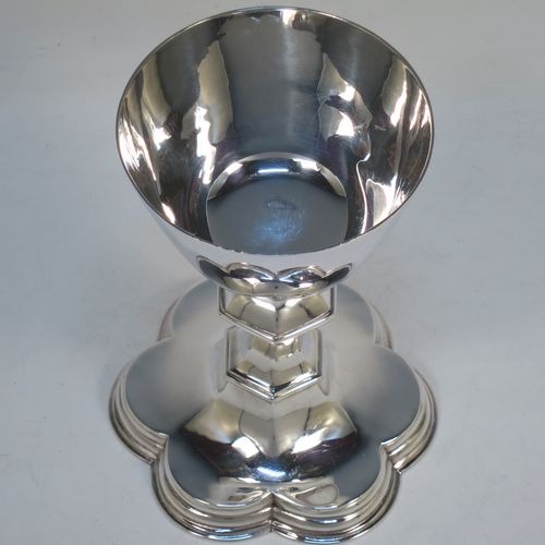 A very handsome Antique Edwardian Sterling Silver altar chalice, having a plain round bellied cup, a hexagonal column with middle baluster, and a lobed spreading hexafoil foot with double reeded border. Made by Horace Woodward and Co., of London in 1907. The dimensions of this fine hand-made antique silver altar chalice are height 16.5 cms (6.5 inches), diameter of cup 9 cms (3.5 inches), diameter at base 11.5 cms (4.5 inches), and it weighs approx. 349g (11.3 troy ounces).   