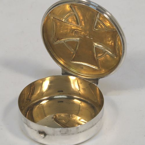 A large and very handsome Sterling Silver Pyx box, having a plain round body with an applied reeded top border, a hinged lid with a hand-chased Cruciform  Christogram, a ring-handle and thumb-piece, and a gold-gilt interior. This elegant silver pyx box was made by A. R. Mowbray and Co. Ltd., of London in 1946. The dimensions of this fine hand-made silver Pyx box are diameter 5 cms (2 inches), depth 1.5 cms (0.6 inches), and it weighs approx. 31g (1 troy ounce).   