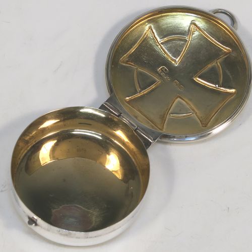 A large and very handsome Sterling Silver Pyx box, having a plain round body with an applied reeded top border, a hinged lid with a hand-chased Cruciform  Christogram, a ring-handle and thumb-piece, and a gold-gilt interior. This elegant silver pyx box was made by A. R. Mowbray and Co. Ltd., of London in 1946. The dimensions of this fine hand-made silver Pyx box are diameter 5 cms (2 inches), depth 1.5 cms (0.6 inches), and it weighs approx. 31g (1 troy ounce).   