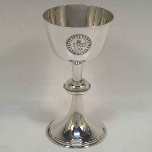 A handsome Antique Victorian Sterling Silver altar chalice, having a plain round tapering cup, a middle plain round stepped baluster, sitting on a round stepped pedestal foot. This beautiful silver chalice was made by Angel and Savory of London in 1894. The dimensions of this fine hand-made antique silver chalice are height 16 cms (6.3 inches), diameter at lip 8 cms (3.25 inches), and it weighs approx. 207g (6.7 troy ounces). Please note that this item has a contemporaneous inscription underneath. 