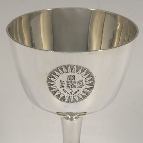 A handsome Antique Victorian Sterling Silver altar chalice, having a plain round tapering cup, a middle plain round stepped baluster, sitting on a round stepped pedestal foot. This beautiful silver chalice was made by Angel and Savory of London in 1894. The dimensions of this fine hand-made antique silver chalice are height 16 cms (6.3 inches), diameter at lip 8 cms (3.25 inches), and it weighs approx. 207g (6.7 troy ounces). Please note that this item has a contemporaneous inscription underneath. 