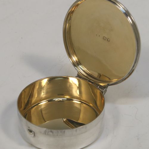 A large and very handsome Sterling Silver Pyx box, having a plain round body, a hinged lid with a hand-engraved Christogram over a cross, a gold-gilt interior, and a clasp with ring handle. This elegant sterling silver Pyx box was made by A. R. Mowbray of London in 1960. The dimensions of this fine hand-made silver Pyx box are diameter 4.5 cms (1.75 inches), depth 2 cms (0.8 inches), and it weighs approx. 33g (1 troy ounce).   