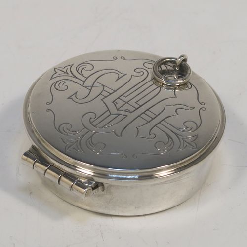 A large and very handsome Sterling Silver Pyx box, having a plain round body, a hinged lid with a hand-engraved Christogram over a cross, a gold-gilt interior, and a clasp with ring handle. This elegant sterling silver Pyx box was made by A. R. Mowbray of London in 1960. The dimensions of this fine hand-made silver Pyx box are diameter 4.5 cms (1.75 inches), depth 2 cms (0.8 inches), and it weighs approx. 33g (1 troy ounce).   