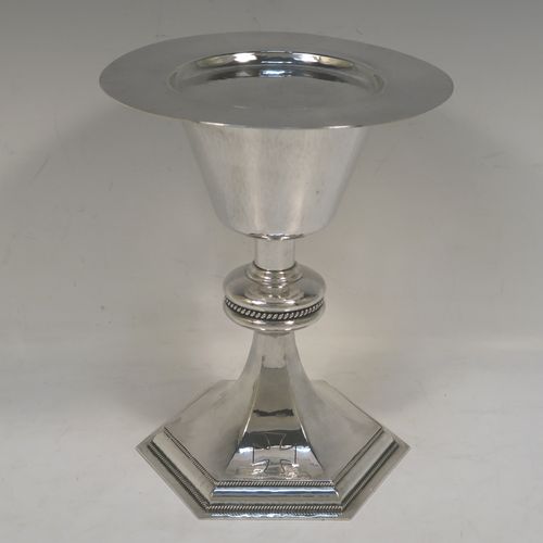 A very handsome Sterling Silver altar chalice and paten, having a round hand-hammered tapering cup, a middle baluster with an applied gadroon band, and a spreading hexagonal pedestal foot with applied double gadroon borders, together with a round hand-hammered paten. This elegant silver chalice and paten was made by Hurst, Franklin and Co., of London in 1954 (the paten made in 1959). The dimensions of this fine hand-made silver chalice and paten are height 19.5 cms (7.75 inches), diameter of paten 15.5 cms (6 inches), and it weighs approx. 573g (18.5 troy ounces).   