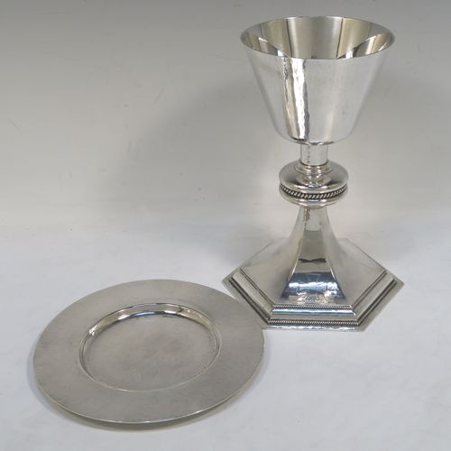 A very handsome Sterling Silver altar chalice and paten, having a round hand-hammered tapering cup, a middle baluster with an applied gadroon band, and a spreading hexagonal pedestal foot with applied double gadroon borders, together with a round hand-hammered paten. This elegant silver chalice and paten was made by Hurst, Franklin and Co., of London in 1954 (the paten made in 1959). The dimensions of this fine hand-made silver chalice and paten are height 19.5 cms (7.75 inches), diameter of paten 15.5 cms (6 inches), and it weighs approx. 573g (18.5 troy ounces).   