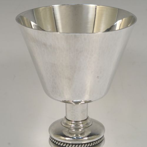 A very handsome Sterling Silver altar chalice and paten, having a round hand-hammered tapering cup, a middle baluster with an applied gadroon band, and a spreading hexagonal pedestal foot with applied double gadroon borders, together with a round hand-hammered paten. This elegant silver chalice and paten was made by Hurst, Franklin and Co., of London in 1954 (the paten made in 1959). The dimensions of this fine hand-made silver chalice and paten are height 19.5 cms (7.75 inches), diameter of paten 15.5 cms (6 inches), and it weighs approx. 573g (18.5 troy ounces).   