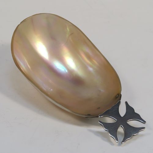 A rare and very pretty Antique Edwardian Sterling Silver and Mother-of-Pearl Anointing or Baptismal holy water Shell, having a silver handle pinned to a shell scoop, all in original very good condition with no damage to the mother-of-pearl. This beautiful baptism or anointing shell was made in London in 1910. The dimensions of this fine hand-made Baptism or Anointing Shell are length 12 cms (4.75 inches), and width 5.5 cms (2.25 inches).  