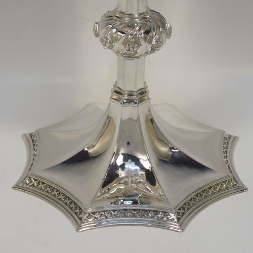 A large and handsome Sterling Silver altar chalice having a hand-hammered or planished finish, with  a round tapering cup and a gold-gilt interior, an octagonal panelled stem with a central applied jewel-like baluster, and all sitting on a spreading octagonal panelled base with an applied fleur-de-lis border. This beautiful and impressive silver altar chalice was made made by A. R. Mowbray and Co., Ltd., of London in 1948. The dimensions of this fine hand-made silver chalice are height 20 cms (8 inches), diameter at lip of cup 10 cms (4 inches), spread across base 15 cms (6 inches), and it weighs approx. 444g (14.3 troy ounces).   