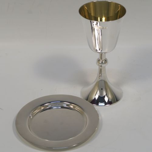 An elegant Antique Sterling Silver travelling communion chalice, having a plain round tapering cup with a gold-gilt interior, a round column with a middle baluster, and a spreading round pedestal foot, together with a matching plain round paten. The chalice was made by the Dixon Brothers of Sheffield in 1911, whilst the paten was made by A. E. Jones of Sheffield in 1962. The dimensions of this fine hand-made antique silver chalice & paten are height of chalice 12 cms (4.75 inches), diameter of paten 10 cms (4 inches), and the total weight is 137g (4.4 troy ounces).   