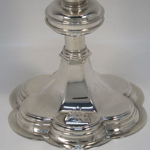 A pair of very handsome Sterling Silver altar chalices, having plain round tapering cups, with middle round balusters, and sitting on spreading hexafoil feet. This elegant pair of silver chalices were made by Blunt and Wray of London in 1928. The dimensions of these fine hand-made pair of silver chalices are height 16 cms (6.3 inches), diameter of cups at lip 8.5 cms (3.3 inches), and with a total weight of approx. 366g (11.8 troy ounces).  