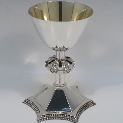 A very handsome Antique Victorian Sterling Silver altar chalice and paten. The chalice having a round tapering cup and lemon gold-gilt interior, an octagonal panelled stem with a central applied jewel-like baluster, and all sitting on a spreading octagonal panelled base with an applied double bead-edged border. This beautiful silver altar chalice was made made by William Gibson and John Langland of London in 1899. The paten which has a very plain round body was made by Goldsmiths and Silversmiths of London in 1900. The dimensions of this fine hand-made antique silver chalice are height 16.5 cms (6.5 inches), diameter at lip of cup 10 cms (4 inches), spread across base 12.5 cms (5 inches), diameter of paten 15 cms (6 inches), with a total weight of approx. 465g (15 troy ounces).   