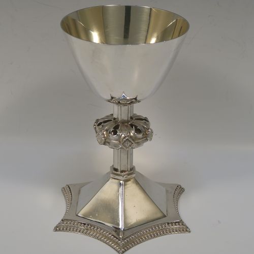 A very handsome Antique Victorian Sterling Silver altar chalice having a round tapering cup and lemon gold-gilt interior, an octagonal panelled stem with a central applied jewel-like baluster, and all sitting on a spreading octagonal panelled base with an applied double bead-edged border. This beautiful silver altar chalice was made made by William Gibson and John Langland of London in 1899. The dimensions of this fine hand-made antique silver chalice are height 16.5 cms (6.5 inches), diameter at lip of cup 10 cms (4 inches), spread across base 12.5 cms (5 inches), and it weighs approx. 313g (10 troy ounces).   