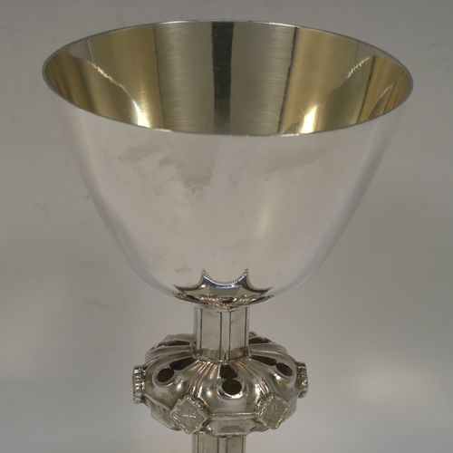 A very handsome Antique Victorian Sterling Silver altar chalice having a round tapering cup and lemon gold-gilt interior, an octagonal panelled stem with a central applied jewel-like baluster, and all sitting on a spreading octagonal panelled base with an applied double bead-edged border. This beautiful silver altar chalice was made made by William Gibson and John Langland of London in 1899. The dimensions of this fine hand-made antique silver chalice are height 16.5 cms (6.5 inches), diameter at lip of cup 10 cms (4 inches), spread across base 12.5 cms (5 inches), and it weighs approx. 313g (10 troy ounces).   