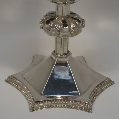 A very handsome Antique Victorian Sterling Silver altar chalice having a round tapering cup and lemon gold-gilt interior, an octagonal panelled stem with a central applied jewel-like baluster, and all sitting on a spreading octagonal panelled base with an applied double bead-edged border. This beautiful silver altar chalice was made made by William Gibson and John Langland of London in 1899. The dimensions of this fine hand-made antique silver chalice are height 16.5 cms (6.5 inches), diameter at lip of cup 10 cms (4 inches), spread across base 12.5 cms (5 inches), and it weighs approx. 313g (10 troy ounces).   