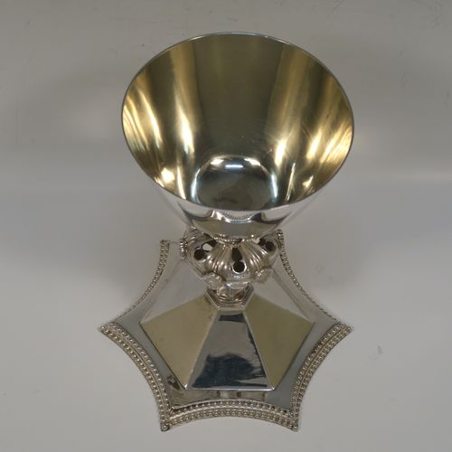 A very handsome Antique Victorian Sterling Silver altar chalice having a round tapering cup and lemon gold-gilt interior, an octagonal panelled stem with a central applied jewel-like baluster, and all sitting on a spreading octagonal panelled base with an applied double bead-edged border. This beautiful silver altar chalice was made made by William Gibson and John Langland of London in 1899. The dimensions of this fine hand-made antique silver chalice are height 16.5 cms (6.5 inches), diameter at lip of cup 10 cms (4 inches), spread across base 12.5 cms (5 inches), and it weighs approx. 313g (10 troy ounces).   