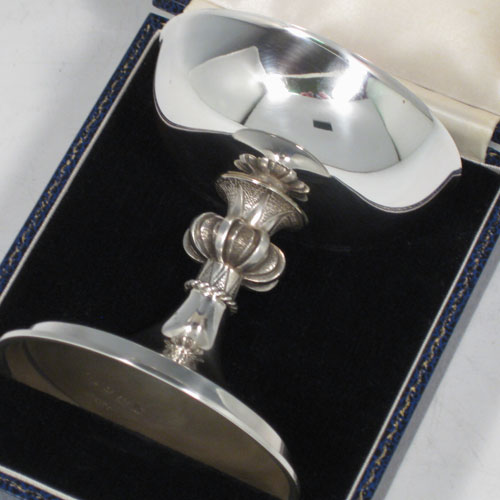 Sterling silver chalice in an Arts and Crafts style, having a plain round cup, a cast octafoil central stem with applied gadroon band, and sitting on a spreading pedestal foot, all in its original satin and velvet-lined presentation box. Made by A. E. Jones of Birmingham in 1972. The dimensions of this fine hand-made silver chalice are height 10 cms (4 inches), diameter 9 cms (3.5 inches), and it weighs approx. 180g (5.8 troy ounces).