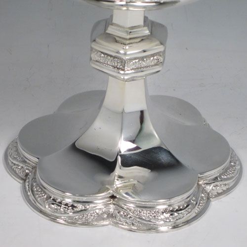 Sterling silver Ciborium, having a plain round body, sitting on a hexafoil base with hand-chased grape-vine border, a lift-off lid with crucifix finial, and gold-gilt interior. Made by Francis Tucker and Co. Ltd., of London in 1940. The dimensions of this fine hand-made silver ciborium are height 22 cms (8.75 inches), diameter 12 cms (5 inches), and it weighs a total of approx. 618g (20 troy ounces). 