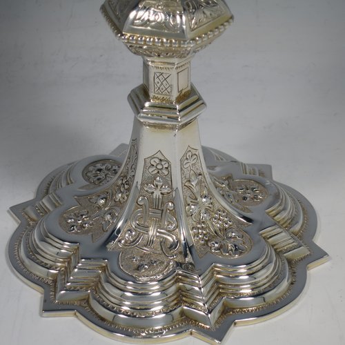 An Irish Sterling Silver altar chalice and paten, having a plain round tapering gold-gilt cup, a panelled column with a middle baluster, and a spreading pedestal foot, all hand-chased and engraved with floral & geometrical work, together with a plain round gold-gilt paten. Made by the same maker (J.S)  of Dublin in 1935/39. The dimensions of this fine hand-made silver chalice & paten are height 23 cms (9 inches), diameter at base 13.5 cms (5.3 inches), and it weighs approx. 607g (19.6 troy ounces). Please note that there is an inscription under the base.   