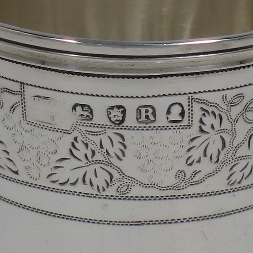 An Antique Georgian Sterling Silver small travelling communion chalice with reeded borders, having a round cup with tapering sides and a hand-engraved upper band of grape-vine decoration, a middle baluster with an applied reeded band, and sitting on a round pedestal foot. Made by Thomas Wallis II and Jonathan Hayne of London in 1812. The dimensions of this fine hand-made antique silver travelling communion chalice are height 10 cms (4 inches), diameter at lip 5 cms (2 inches), and it weighs approx. 84g (2.7 troy ounces).    