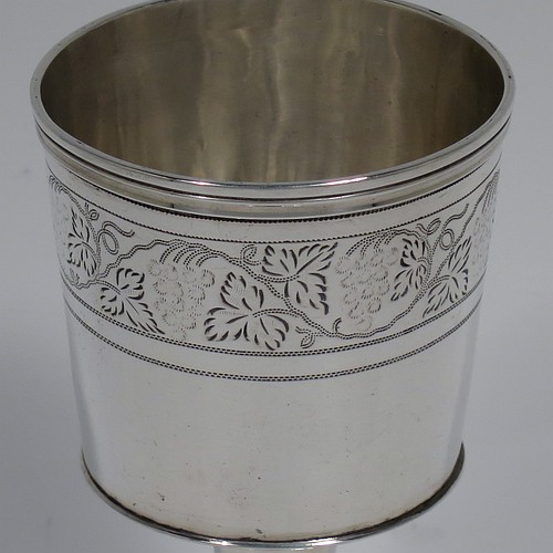 An Antique Georgian Sterling Silver small travelling communion chalice with reeded borders, having a round cup with tapering sides and a hand-engraved upper band of grape-vine decoration, a middle baluster with an applied reeded band, and sitting on a round pedestal foot. Made by Thomas Wallis II and Jonathan Hayne of London in 1812. The dimensions of this fine hand-made antique silver travelling communion chalice are height 10 cms (4 inches), diameter at lip 5 cms (2 inches), and it weighs approx. 84g (2.7 troy ounces).    