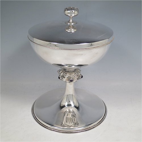 A large Antique Sterling Silver Ciborium, having a plain round body with applied rope-twist borders, sitting on a matching pedestal foot, a gold-gilt interior with a lift-off lid and cast finial, with a central baluster having six applied Amethyst Cabochon semi-precious stones. Made in London in 1914. The dimensions of this fine hand-made antique silver ciborium are height 23 cms (9 inches), diameter of cup 17 cms (6.75 inches), and it weighs a total of approx. 790g (25.5 troy ounces).    