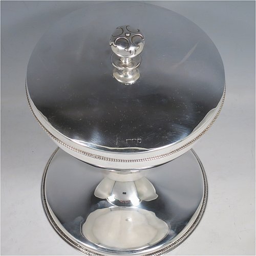 A large Antique Sterling Silver Ciborium, having a plain round body with applied rope-twist borders, sitting on a matching pedestal foot, a gold-gilt interior with a lift-off lid and cast finial, with a central baluster having six applied Amethyst Cabochon semi-precious stones. Made in London in 1914. The dimensions of this fine hand-made antique silver ciborium are height 23 cms (9 inches), diameter of cup 17 cms (6.75 inches), and it weighs a total of approx. 790g (25.5 troy ounces).    