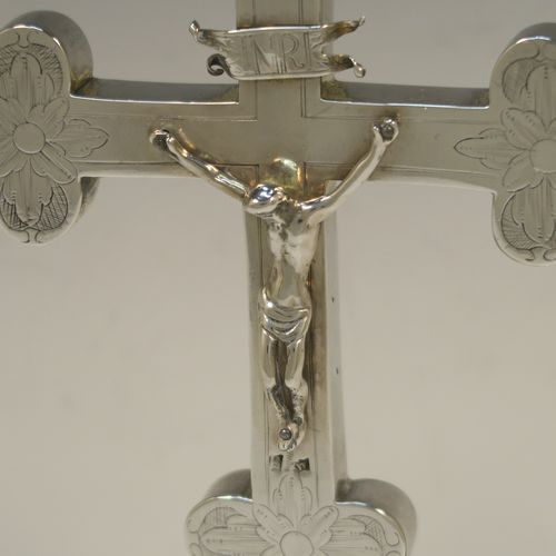 A beautiful Antique early 18th century (possibly late 17th century) continental Sterling Silver altar table cross, showing Christ on the cross and INRI above, with hand-engraved and chased floral decoration. Made in ca 1700 possibly in the city of Breslau (ex-Germany), now Wroclaw (Poland). The dimensions of this fine hand-made antique silver altar cross are height 27 cms (10.75 inches), width 13.5 cms (5.3 inches), with a total weight of approx. 292g (9.4 troy ounces).   