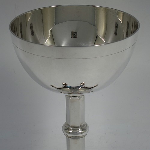 A very handsome Antique Victorian Sterling Silver altar chalice, having a plain round bellied cup, a hexagonal column with a middle baluster, and sitting on a spreading hexafoil pedestal foot. Made by the Barnard Brothers of London in 1857. The dimensions of this fine hand-made antique silver chalice is height 16 cms (6.3 inches), diameter of cup 10 cms (4 inches), and it weighs approx. 328g (10.6 troy ounces). Please note that this item is engraved with a christogram.