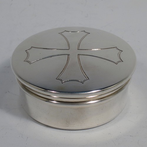 A heavy Sterling Silver Pyx box, having a plain round body, a pull-off lid with a hand-engraved Christogram, a gold-gilt interior, and sitting on a flat base. Made by H. F. and Co. Ltd., of London in 1965. The dimensions of this fine hand-made silver Pyx box are diameter 6.5 cms (2.75 inches), depth 3 cms (1.25 inches), and it weighs approx. 91g (3 troy ounces). 