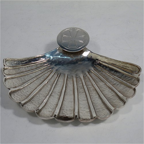 A very unusual cast Sterling Silver Anointing or Baptismal holy water Shell, having a traditional scallop shape, with hand-chased and hammered decoration, and a round handle with hand-engraved Christogram. Made in Birmingham in 1931. The dimensions of this fine hand-made Baptism or Anointing Shell are length 12 cms (4.75 inches), width 13 cms (5 inches), and weighing approx. 160g (5.2 troy ounces).    