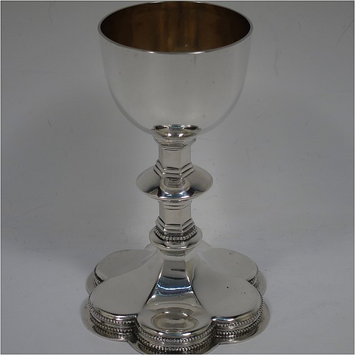 An Antique Victorian Sterling Silver altar chalice, having a plain round bellied cup with a gold-gilt interior, a hexagonal column with middle baluster, and a lobed spreading hexafoil foot with an applied double bead-edged border. Made by George Lambert of London in 1891. The dimensions of this fine hand-made antique silver altar chalice are height 15 cms (6 inches), diameter of cup 7cms (2.75 inches), diameter at base 10 cms (4 inches), and it weighs approx. 274g (8.8 troy ounces).   