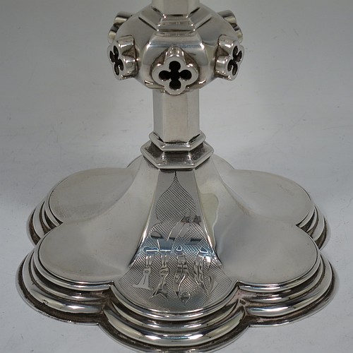 A very handsome and large Antique Victorian Sterling Silver altar chalice, having a plain round bellied cup with a gold-gilt interior, a hexagonal column with middle baluster having hand-pierced and applied cruciform decoration, and a lobed spreading hexagonal foot with a stepped lower border. Made by John Figg (poss.) of London in 1866. The dimensions of this fine hand-made antique silver altar chalice are height 20 cms (8 inches), diameter of cup 11cms (4.3 inches), diameter at base 13.5 cms (5.3 inches), and it weighs approx. 367g (12 troy ounces).  Please note that this has hand-engraved Christograms on the foot and cup. 