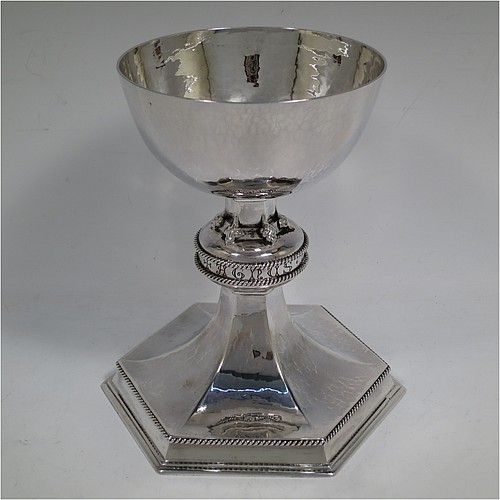 A beautiful and large Sterling Silver altar chalice with hand-hammered decoration, having a plain round cup with tapering sides, a hexagonal column with a middle baluster which has applied cast floral corners and the engraved Latin liturgy  of Agnus Dei (Lamb of God) between a double band of applied rope-twist work, and all sitting on a spreading pedestal foot with rope-twist border. Made by Albert John Watts of London in 1944. The dimensions of this fine hand-made silver altar chalice are height 18.5 cms (7.25 inches), width at base 16.5 cms (6.5 inches), and it weighs approx. 600g (19 troy ounces).    