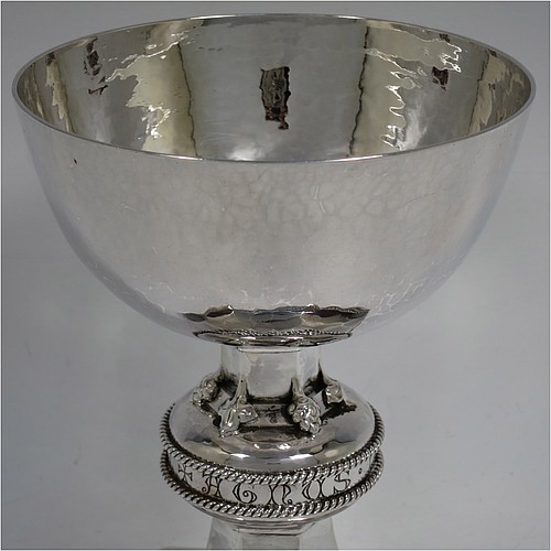 A beautiful and large Sterling Silver altar chalice with hand-hammered decoration, having a plain round cup with tapering sides, a hexagonal column with a middle baluster which has applied cast floral corners and the engraved Latin liturgy  of Agnus Dei (Lamb of God) between a double band of applied rope-twist work, and all sitting on a spreading pedestal foot with rope-twist border. Made by Albert John Watts of London in 1944. The dimensions of this fine hand-made silver altar chalice are height 18.5 cms (7.25 inches), width at base 16.5 cms (6.5 inches), and it weighs approx. 600g (19 troy ounces).    