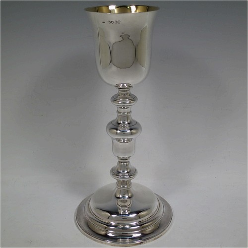 A tall and handsome Antique Victorian Sterling Silver altar chalice, having a plain round bellied cup with a gold-gilt interior, a round multiple baluster column, and sitting on a stepped round pedestal foot. Made by John Samuel Hunt (of Hunt and Roskell the Royal Goldsmiths) of London in 1863. The dimensions of this fine hand-made antique silver altar chalice are height 27.5 cms (10.75 inches), diameter of cup 8.5cms (3.3 inches), diameter at base 13.5 cms (5.25 inches), and it weighs approx. 452g (14.6 troy ounces).    