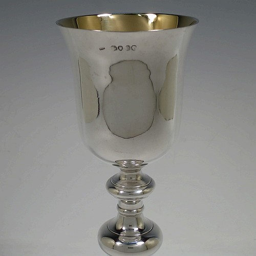 A tall and handsome Antique Victorian Sterling Silver altar chalice, having a plain round bellied cup with a gold-gilt interior, a round multiple baluster column, and sitting on a stepped round pedestal foot. Made by John Samuel Hunt (of Hunt and Roskell the Royal Goldsmiths) of London in 1863. The dimensions of this fine hand-made antique silver altar chalice are height 27.5 cms (10.75 inches), diameter of cup 8.5cms (3.3 inches), diameter at base 13.5 cms (5.25 inches), and it weighs approx. 452g (14.6 troy ounces).    