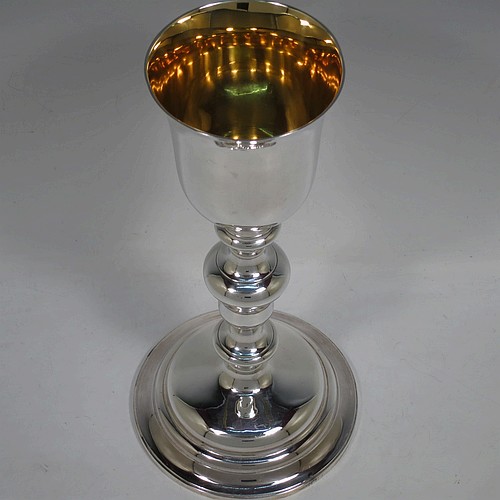 A tall and handsome Antique Victorian Sterling Silver altar chalice, having a plain round bellied cup with a gold-gilt interior, a round multiple baluster column, and sitting on a stepped round pedestal foot. Made by John Samuel Hunt (of Hunt and Roskell the Royal Goldsmiths) of London in 1863. The dimensions of this fine hand-made antique silver altar chalice are height 27.5 cms (10.75 inches), diameter of cup 8.5cms (3.3 inches), diameter at base 13.5 cms (5.25 inches), and it weighs approx. 452g (14.6 troy ounces).    