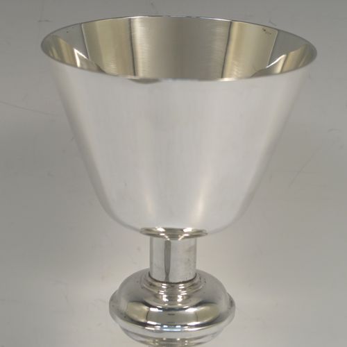 A handsome and large Antique Sterling Silver church altar chalice and paten, having a plain round tapering cup, a middle plain round stepped baluster, sitting on a round stepped pedestal foot, and a matching plain round paten. This elegant antique silver chalice and paten was made by Fredrick Dendy Wray of London in 1913. The dimensions of this fine hand-made antique silver chalice and paten are height of chalice 21 cms (8.25 inches), diameter of paten 15 cms (6 inches), and with a total weight of approx.465g (15 troy ounces).  