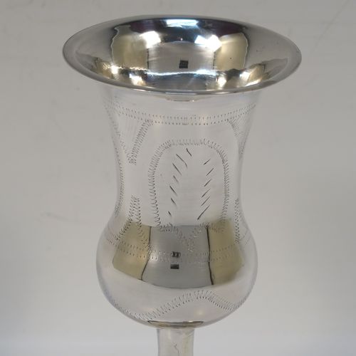 A large and very handsome Sterling Silver beaker, Becher, or Kiddush cup, having a plain round bellied body with hand-engraved stipple floral work, and sitting on a round pedestal foot. This elegant silver Kiddush or Becher beaker was made by Joseph Rosenweig of London in 1918. The dimensions of this fine hand-made silver beaker or Kiddush cup are height 14.5 cms (5.75 inches), diameter at top 6.5 cms (2.5 inches), and it weighs approx. 85g (2.7 troy ounces).   