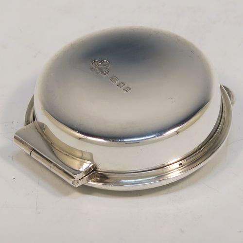 A large and very handsome Sterling Silver Pyx box, having a plain round body, a hinged lid with a hand-engraved Christogram cross, a gold-gilt interior, and a clasp with ring handle. This elegant sterling silver Pyx box was made by Burns, Oats, and Washbourne Ltd., of London in 1930. The dimensions of this fine hand-made silver Pyx box are diameter 5 cms (2 inches), depth 2 cms (0.8 inches), and it weighs approx. 33g (1 troy ounce).  