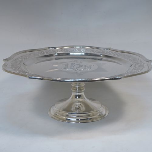 A very handsome and large Antique Edwardian Sterling Silver altar tazza dish for serving the consecrated communion wafers, having a round shaped body with a hand-engraved central Christogram and an engraved border with This Is My Body Which Is Broken For You - This Do In Remembrance Of Me, and all sitting on a plain round pedestal foot. This elegant communion tazza dish was made by Thomas Bradbury of Sheffield in 1902. The dimensions of this fine hand-made antique silver tazza communion dish are diameter 30.5 cms (12 inches), height 11.5 cms (4.5 inches), and it weighs approx. 1,095g (35 troy ounces).  