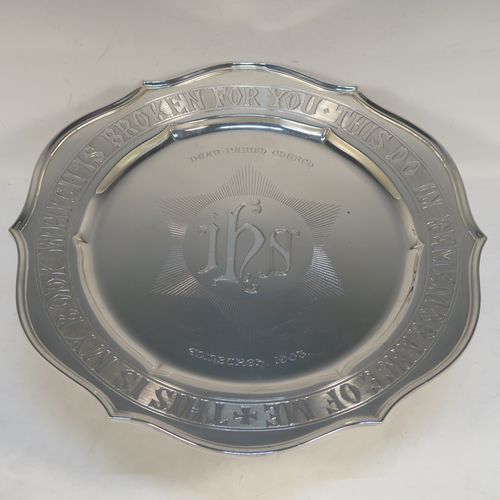 A very handsome and large Antique Edwardian Sterling Silver altar tazza dish for serving the consecrated communion wafers, having a round shaped body with a hand-engraved central Christogram and an engraved border with This Is My Body Which Is Broken For You - This Do In Remembrance Of Me, and all sitting on a plain round pedestal foot. This elegant communion tazza dish was made by Thomas Bradbury of Sheffield in 1902. The dimensions of this fine hand-made antique silver tazza communion dish are diameter 30.5 cms (12 inches), height 11.5 cms (4.5 inches), and it weighs approx. 1,095g (35 troy ounces).  