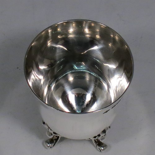 An Antique Edwardian Sterling Silver egg cup, having a plain round body with tapering sides, sitting on four cast foliate feet. Made by Charles Clement Pilling of Sheffield in 1907. The dimensions of this fine hand-made silver egg cup are height 5 cms (2 inches), diameter 4.5 cms (1.75 inches), and it weighs approx. 50g (1.6 troy ounces).   