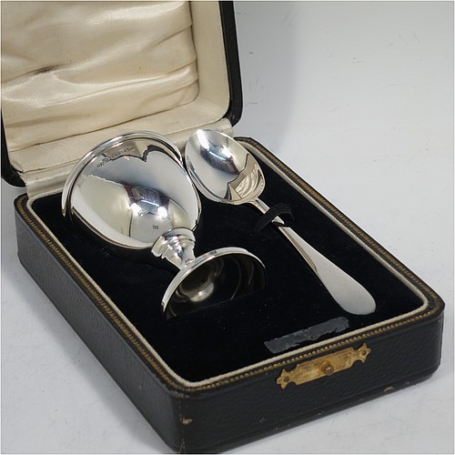 A handsome Sterling Silver egg cup and spoon, having a plain round egg cup with a gold-gilt interior, and a plain Old English pattern spoon. All fitted in their original cream satin and black velvet-lined presentation box. Made by Arthur Price of Birmingham in 1936. The dimensions of this fine hand-made silver egg cup and spoon are length of spoon 11 cms (4.3 inches), height of egg cup 6.5 cms (2.5 inches), and the total weight is approx. 28g (0.9 troy ounce).   