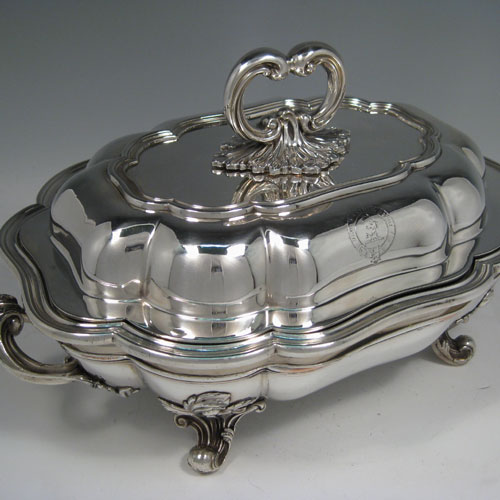    Antique Victorian sterling silver entree dish and cover, having shaped applied reeded border, with removable handle, and sitting on an original Old Sheffield plated hot-water warming stand. All made by T & J Creswick of London in 1843. Length 35 cms (13.75 inches), width 24 cms (9.5 inches), height including handle 19 cms (7.5 inches). Weight of entree dish and cover approx. 1,591g (51 troy ounces). Please note that the cover is crested.