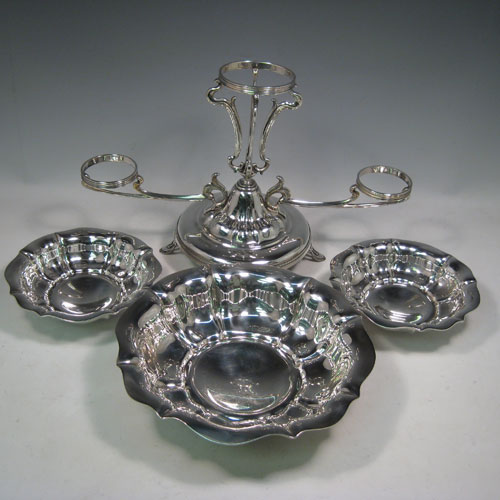 Antique Edwardian sterling silver table epergne center-piece, having an Art Nouveau style, with one central large dish and two smaller dishes resting on side arms, and all sitting on a pedestal base with four pierced feet. Made by Olivant and Botsford of Sheffield in 1907. Height 30 cms (11.75 inches), width 50 cms (19.75 inches), depth 26 cms (10.25 inches). Total weight approx. 2,058 (66.4 troy ounces).